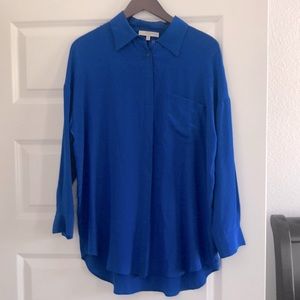 Blue long sleeve silk shirt.